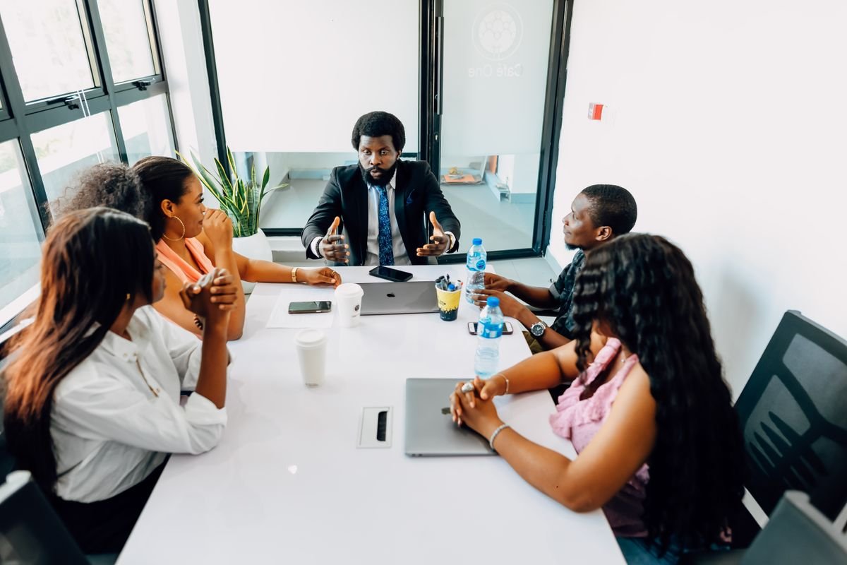 Black professionals participating in a workplace wellbeing discussion