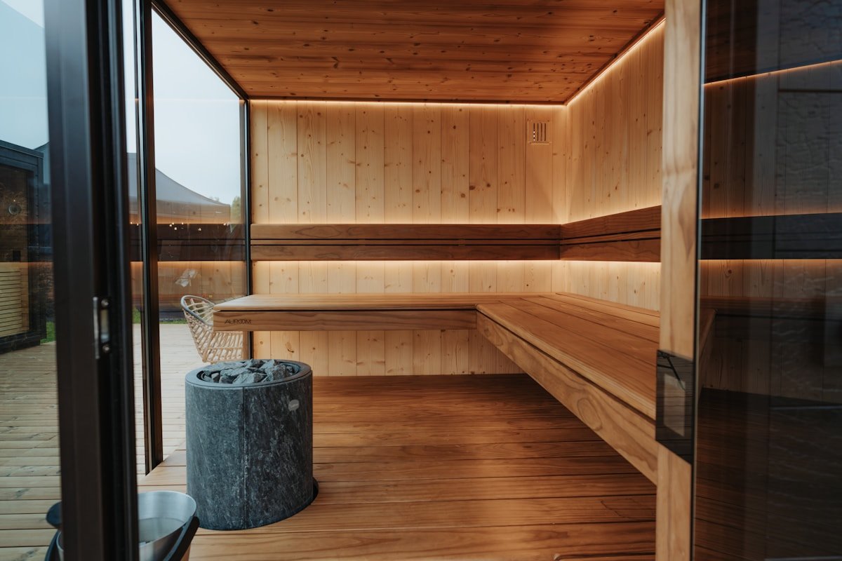 Modern wooden wellness sauna with stone heater