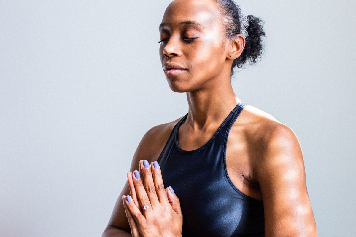 Black woman practising mindful yoga and breathwork